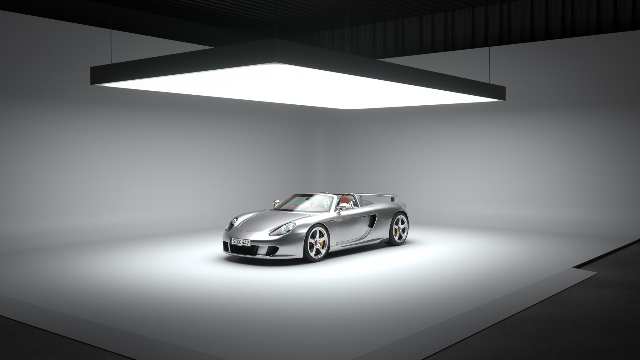 Porsche Carrera GT in a studio under a large overhead softbox